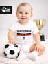 Baby Body WM 2026 Outfit Trikotstyle Weltmeisterschaft Outfit Trikotstyle Fußballgeschenk Jungen Mädchen Baumwolle MoonWorks®preview