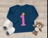 Baby Langarm-Shirt 1. Geburtstag Zahl 1 Krone Geburtstagsshirt Geburtstagsshirt Bio-Baumwolle Junge Mädchen MoonWorks®preview