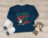 Baby Langarmshirt Weihnachtsshirt Spruch Das schönste Geschenk unterm Baum bin ich Babyshirt Weihnachtsmotiv MoonWorks®preview