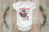 Babybody1.GeburtstagPassaufWeltichbinjetzt1WaschbärkurzarmBodyBio-BaumwolleMoonworks®preview